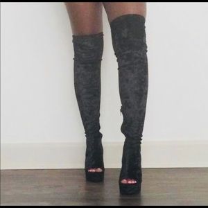 Thigh high black boots